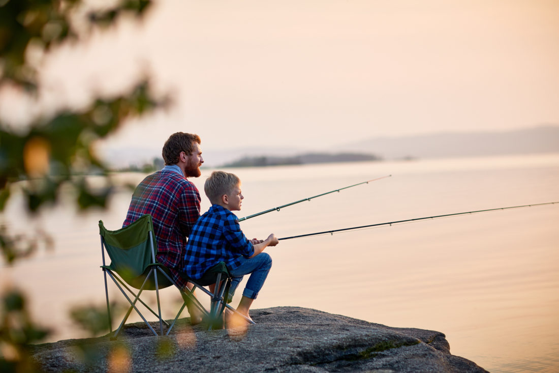 Father and Son Enjoying Fishing Together fishing